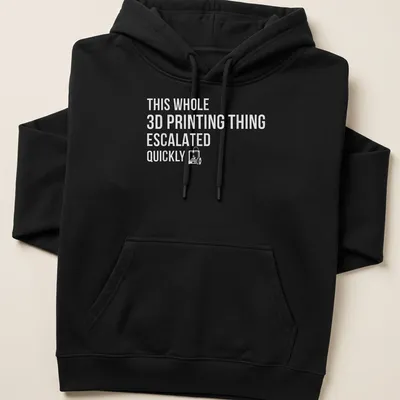 Bold text design reading 'THIS WHOLE 3D PRINTING THING ESCALATED QUICKLY' on gray background — printed on a unisex hoodie