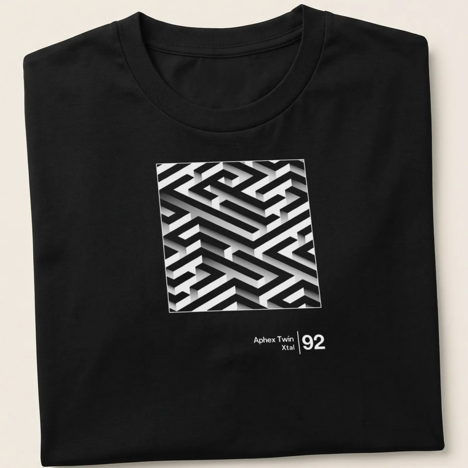 3D maze design featuring 'Aphex Twin Xtal' in white and gray. — printed on a unisex t-shirt