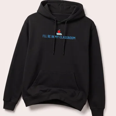 Playful illustration of an apple and books with the text I'll Be In My Classroom — printed on a unisex hoodie
