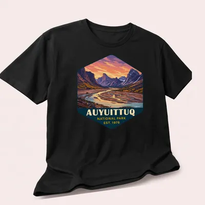 Vibrant landscape design of Auyuittuq National Park with text established 1976 — printed on a unisex t-shirt (angled view)