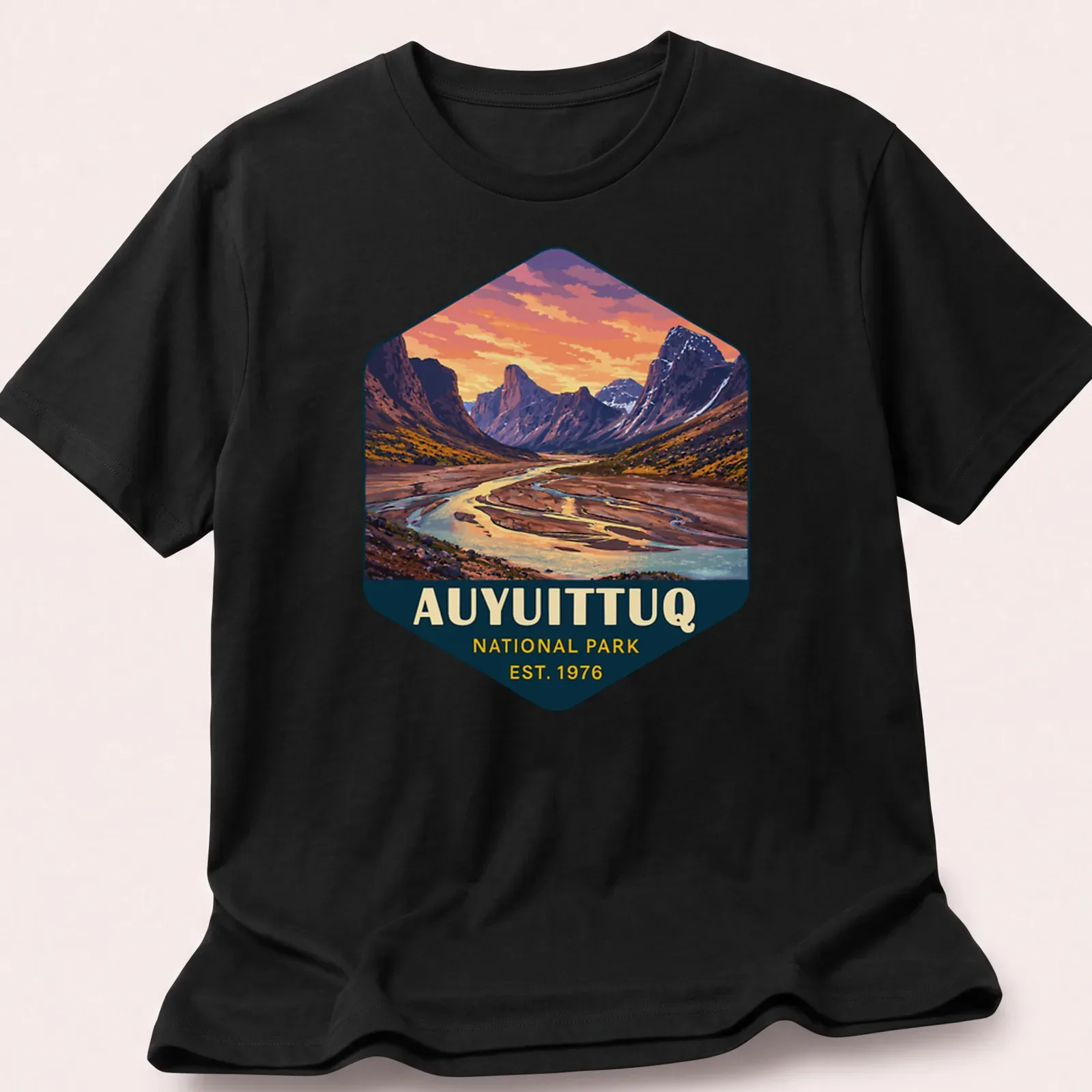Vibrant landscape design of Auyuittuq National Park with text established 1976 — printed on a unisex t-shirt