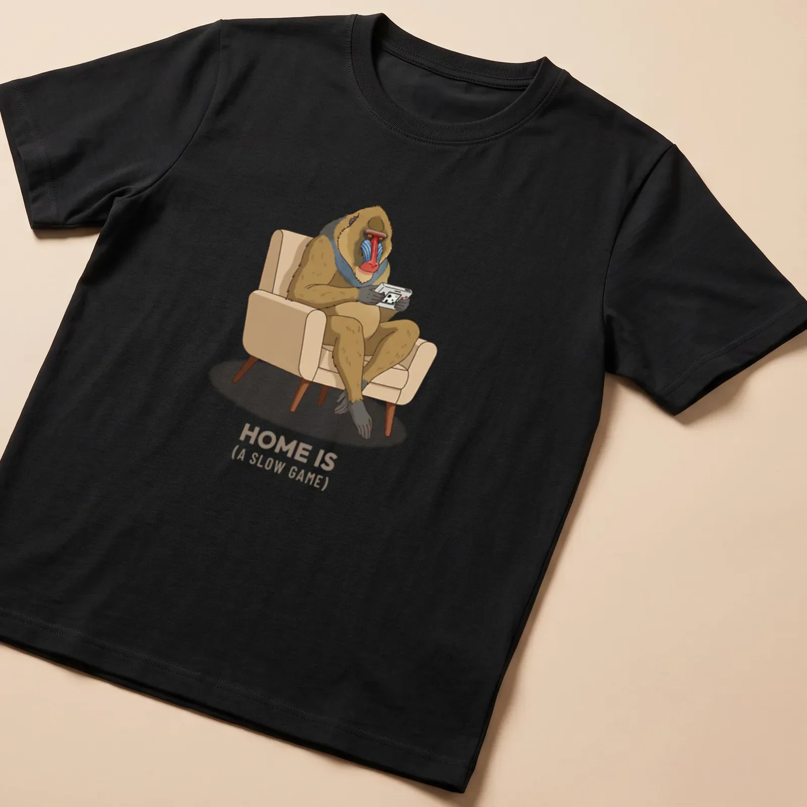 Cartoon baboon playing a handheld game console with humorous text — printed on a unisex t-shirt