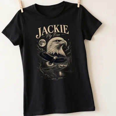 Detailed illustration of a Bald Eagle with text honoring Jackie Fly Free — printed on a women's shirt