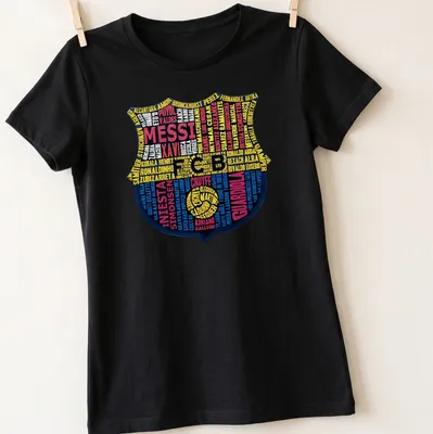 Typography print featuring Barcelona FC legends and crest in blue, yellow, red, and black — printed on a women's shirt