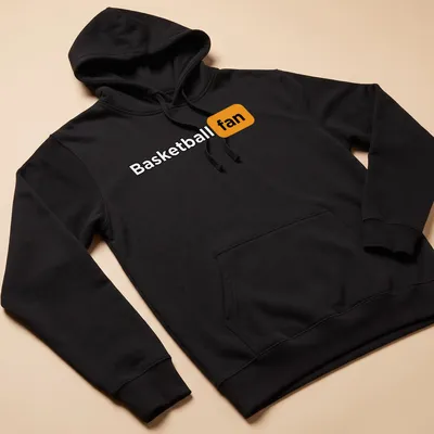 Bold Basketball Fan t-shirt with modern typography in black, orange, and white — printed on a unisex hoodie