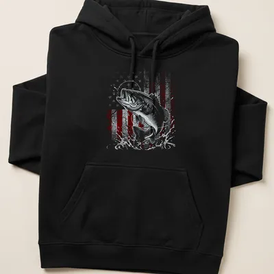 Distressed vintage design of a bass fish jumping with an American flag in red, white, and blue. — printed on a unisex hoodie
