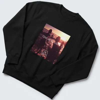 Photographic print of beach silhouettes with 'ONE MORE LIGHT' text in sunset colors. — printed on a unisex sweatshirt