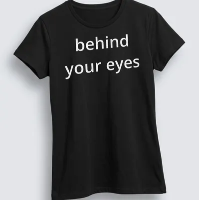 Script font T-shirt with the phrase 'behind your eyes' inviting introspection — printed on a women's shirt
