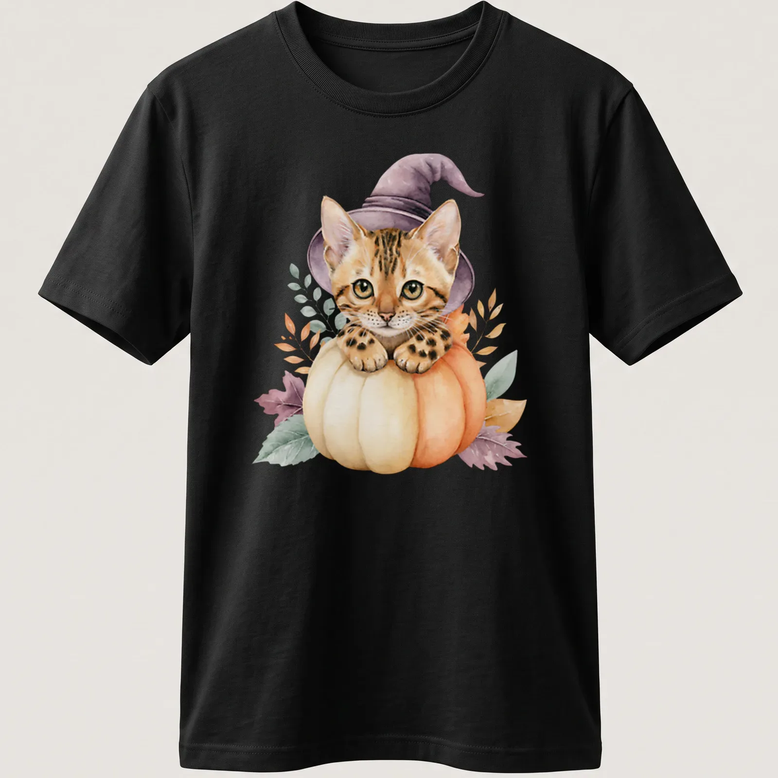 Watercolor Bengal cat in a pumpkin witch hat surrounded by autumn leaves — printed on a unisex t-shirt