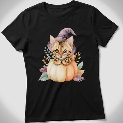 Watercolor Bengal cat in a pumpkin witch hat surrounded by autumn leaves — printed on a women's shirt