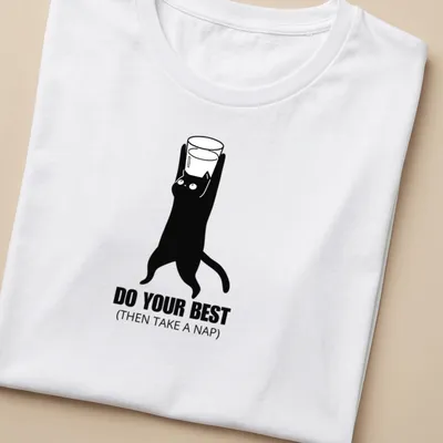 Minimalist black and white cat holding a glass with a motivational phrase. — printed on a women's shirt