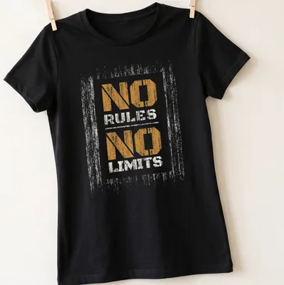 Distressed print featuring the phrase NO RULES NO LIMITS in orange and cream — printed on a women's shirt