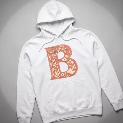 Floral initial B T-shirt design with vintage botanical elements in coral and green — printed on a unisex hoodie