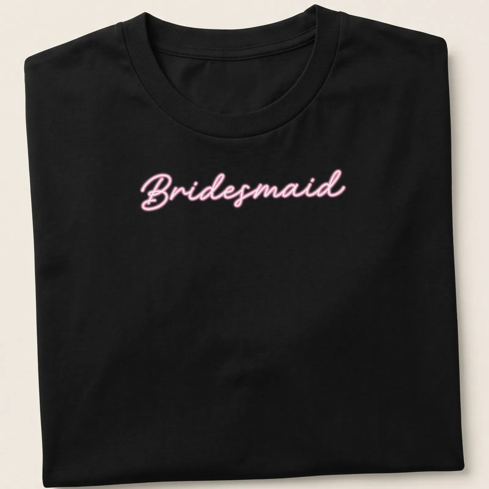 Neon sign style Bridesmaid t-shirt in vibrant pink — printed on a unisex t-shirt