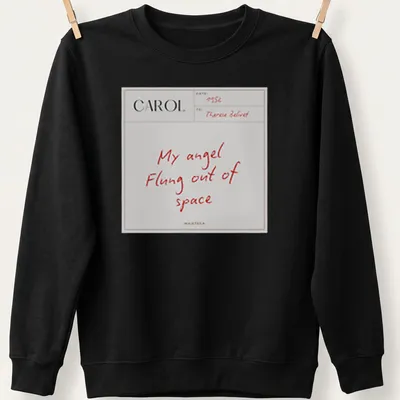 Minimalist t-shirt featuring white text saying 'My angel Flung out of space' on a red background — printed on a unisex sweatshirt