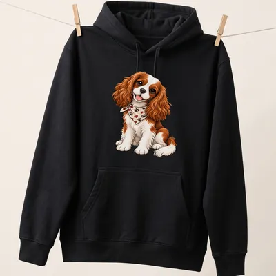 Cartoon Cavalier King Charles Spaniel with playful expression in brown, white, and cream — printed on a unisex hoodie
