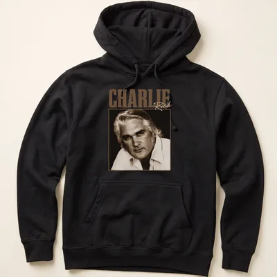 Vintage-style Charlie Rich t-shirt with classic lettering in warm tones — printed on a unisex hoodie