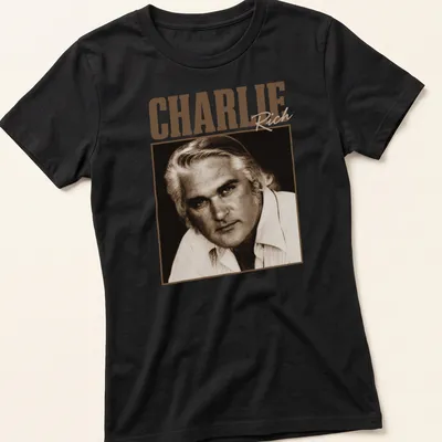 Vintage-style Charlie Rich t-shirt with classic lettering in warm tones — printed on a women's shirt