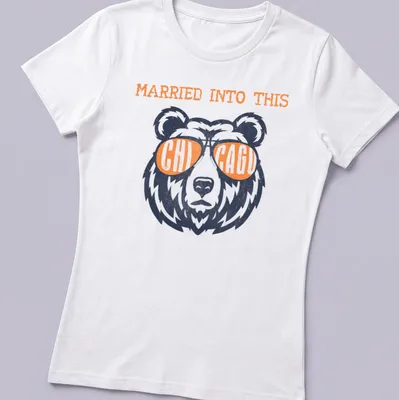 Distressed vintage shirt featuring Chicago Bears football bear and text 'Married Into This' — printed on a women's shirt