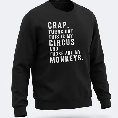 Playful circus-themed t-shirt featuring monkeys and colorful typography — printed on a unisex sweatshirt