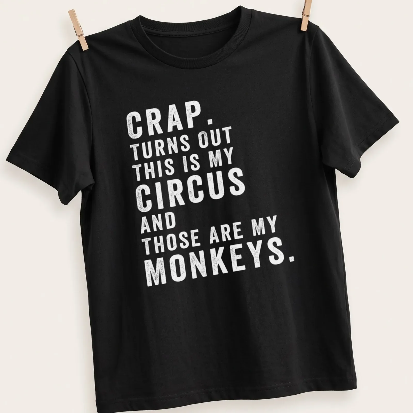 Playful circus-themed t-shirt featuring monkeys and colorful typography — printed on a unisex t-shirt