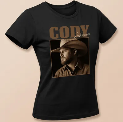 Vintage sepia print of Cody Johnson's name in brown and cream shades — printed on a women's shirt