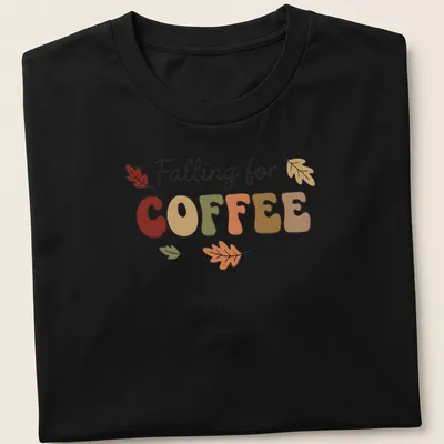 Playful typography t-shirt featuring coffee and colorful autumn leaves