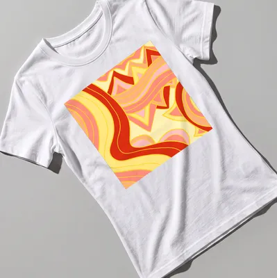 Abstract waves in vibrant colors of yellow, pink, red, and orange — printed on a women's shirt