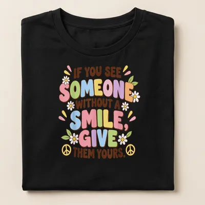 Colorful text design with flowers and peace signs on a playful — printed on a women's shirt