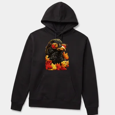 Vibrant illustration of a crow with sunglasses surrounded by autumn leaves in orange and yellow — printed on a unisex hoodie