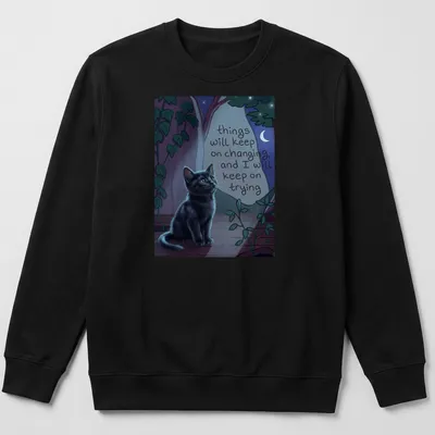 Whimsical illustration of a black cat with a motivational quote among nighttime colors — printed on a unisex sweatshirt