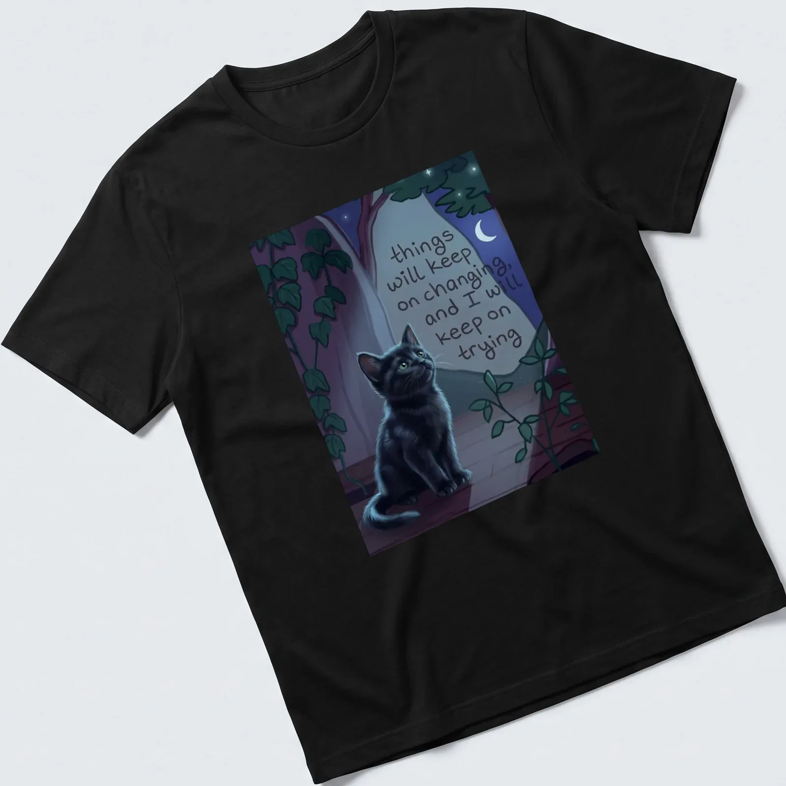 Whimsical illustration of a black cat with a motivational quote among nighttime colors — printed on a unisex t-shirt