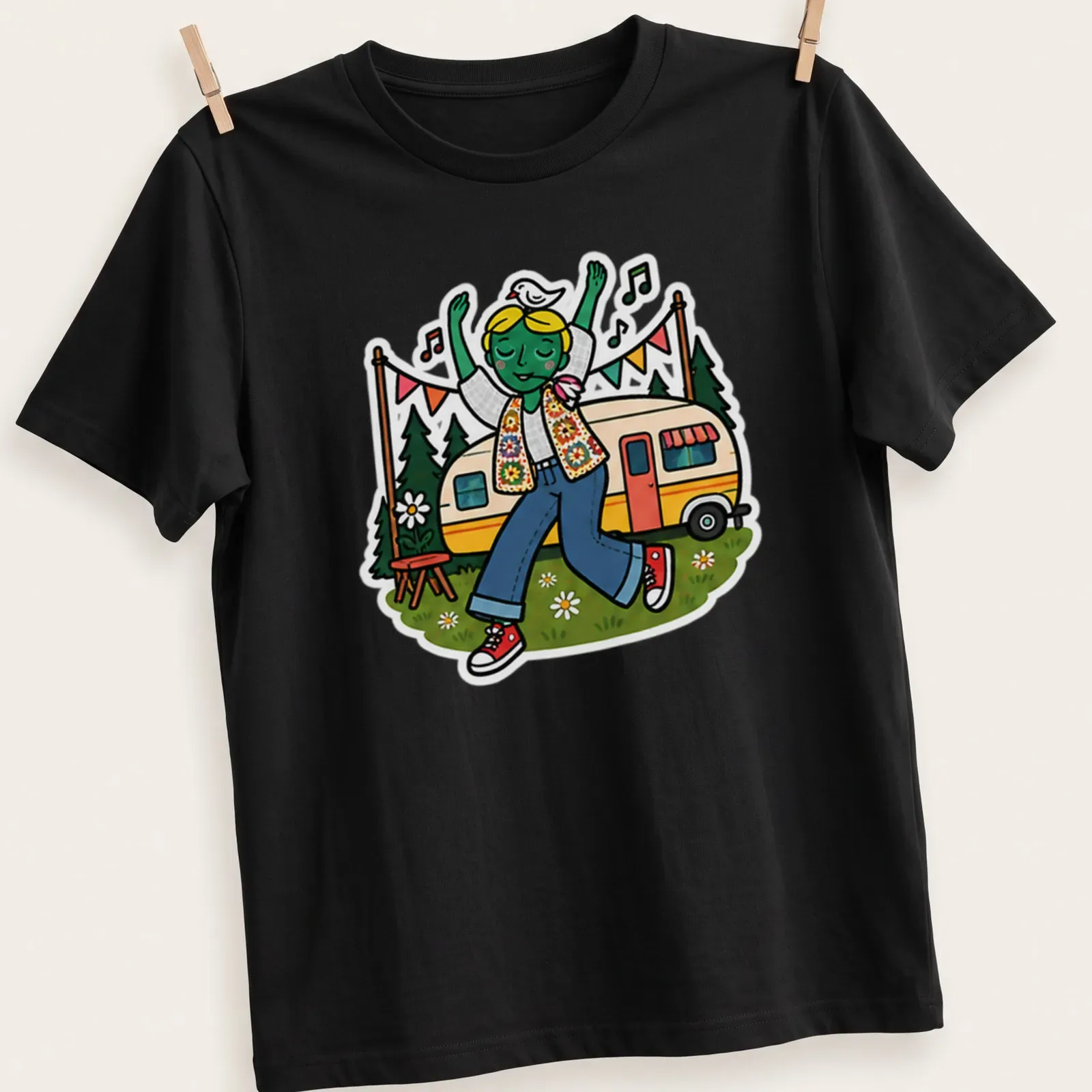 Colorful cartoon T-shirt featuring a dancing caravan with the text 'Festival Camper Vibes' — printed on a unisex t-shirt