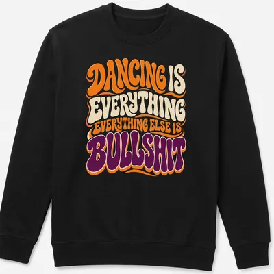 Retro style T-shirt with bold text about dancing in orange, cream, purple, and white — printed on a unisex sweatshirt