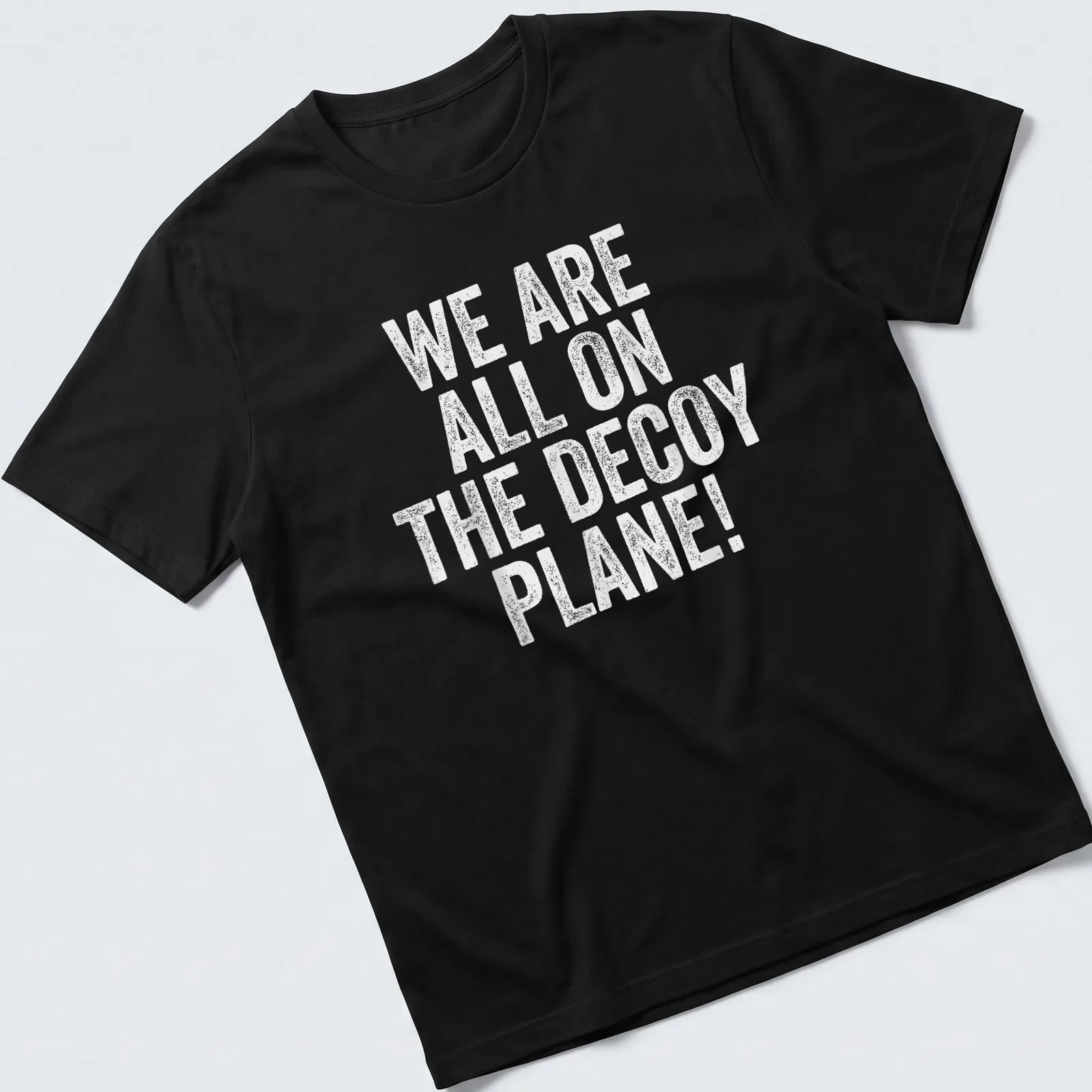 Distressed graphic featuring a decoy plane and playful text. — printed on a unisex t-shirt