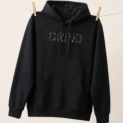 Distressed black and gray t-shirt featuring bold streetwear text that reads 'GRIND' — printed on a unisex hoodie