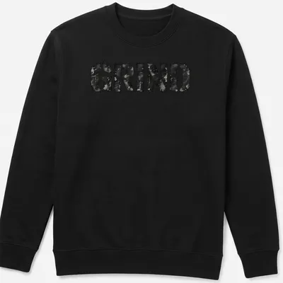 Distressed black and gray t-shirt featuring bold streetwear text that reads 'GRIND' — printed on a unisex sweatshirt