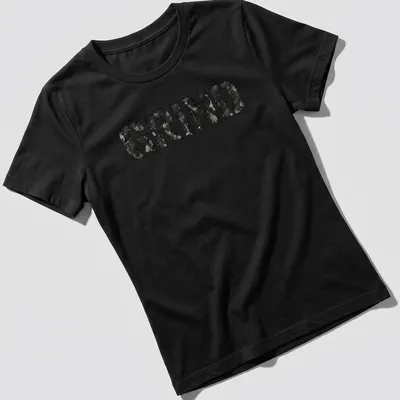 Distressed black and gray t-shirt featuring bold streetwear text that reads 'GRIND' — printed on a women's shirt