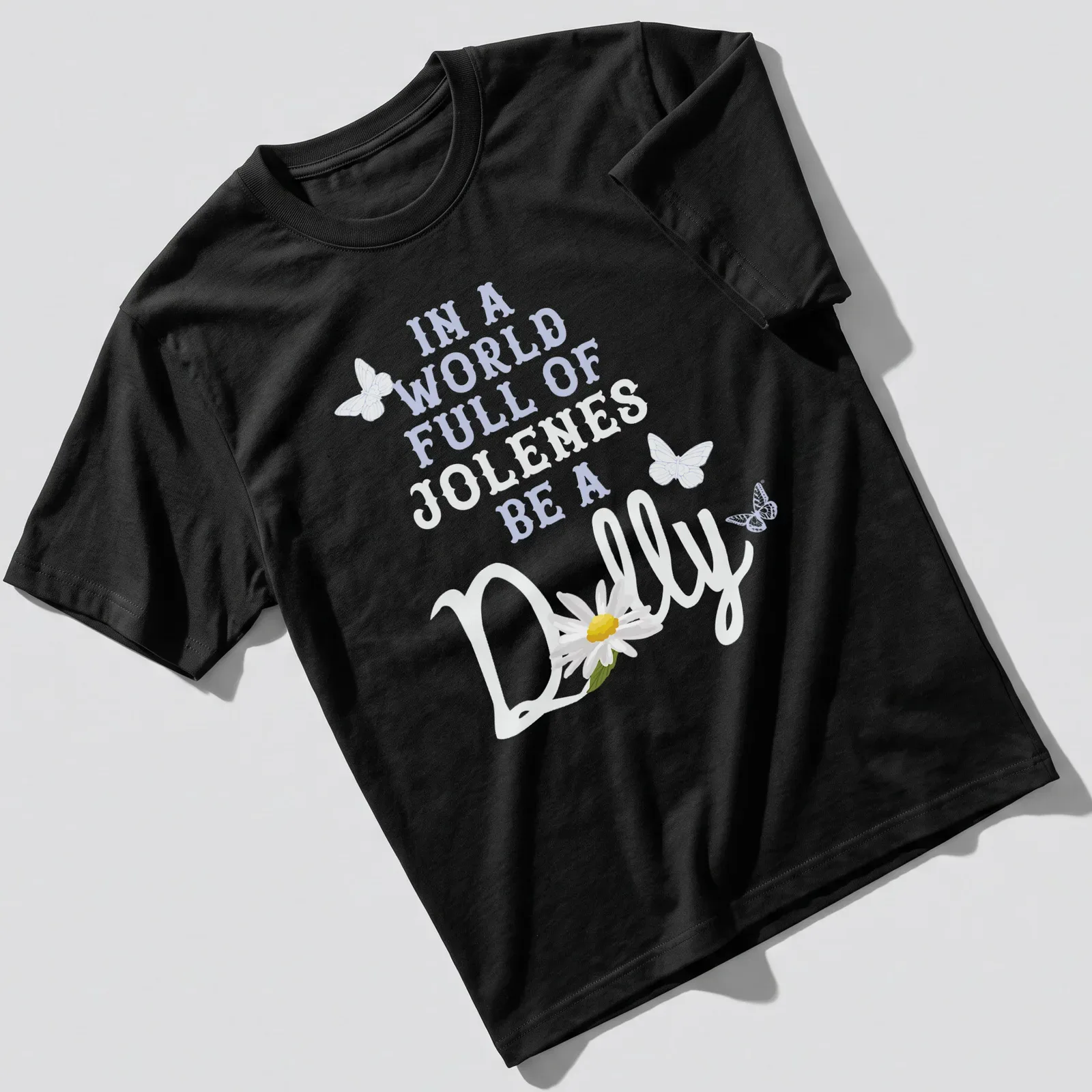 Whimsical design with a daisy and butterflies alongside uplifting text — printed on a unisex t-shirt