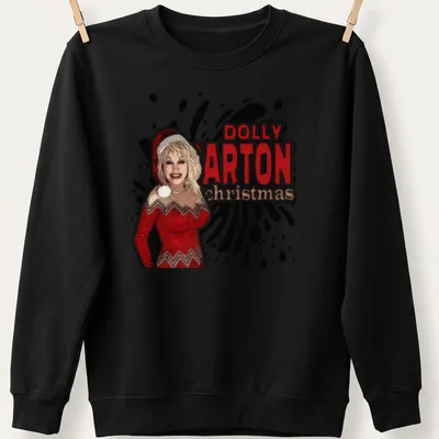 Bold graphic Dolly Parton Christmas T-shirt in red, white, and black — printed on a unisex sweatshirt