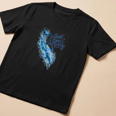 Realistic dolphin swimming design with the phrase 'Just Keep Swimming' in ocean colors