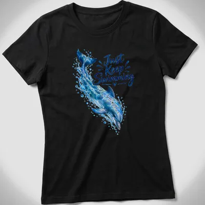 Realistic dolphin swimming design with the phrase 'Just Keep Swimming' in ocean colors — printed on a women's shirt