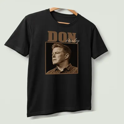Vintage sepia Don Henley t-shirt with bold lettering in brown and beige — printed on a unisex t-shirt (angled view)