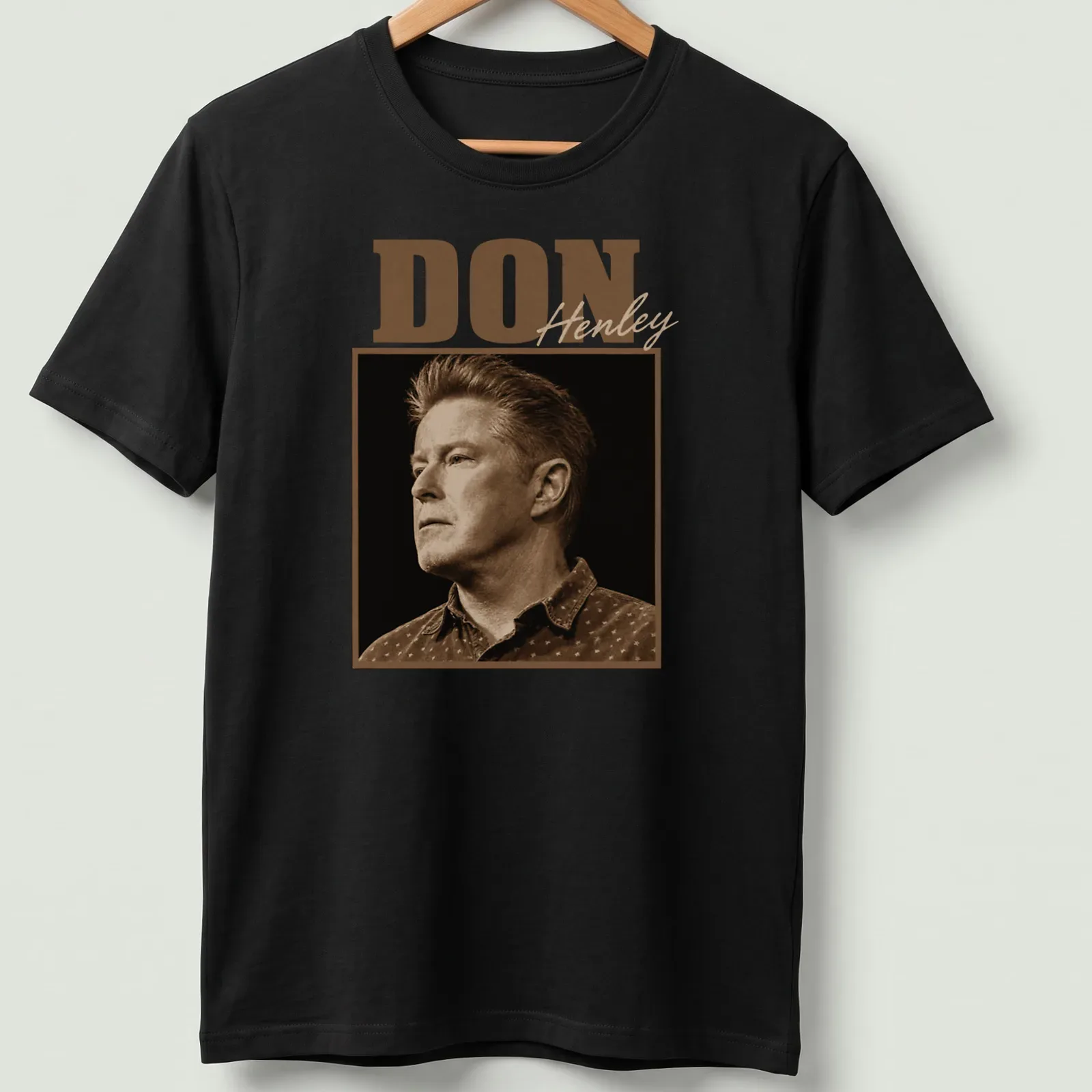 Vintage sepia Don Henley t-shirt with bold lettering in brown and beige — printed on a unisex t-shirt