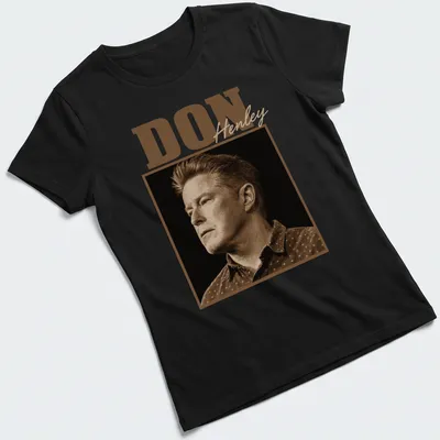 Vintage sepia Don Henley t-shirt with bold lettering in brown and beige — printed on a women's shirt
