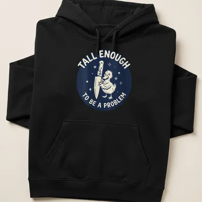 Cartoon duck holding a knife with text reading 'Tall Enough To Be A Problem' in navy and white — printed on a unisex hoodie