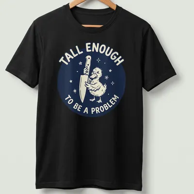 Cartoon duck holding a knife with text reading 'Tall Enough To Be A Problem' in navy and white