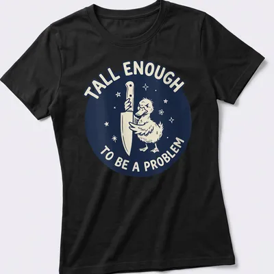 Cartoon duck holding a knife with text reading 'Tall Enough To Be A Problem' in navy and white — printed on a women's shirt