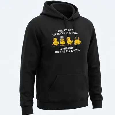 Cartoon ducks humorously illustrated, with text about getting ducks in a row. — printed on a unisex hoodie