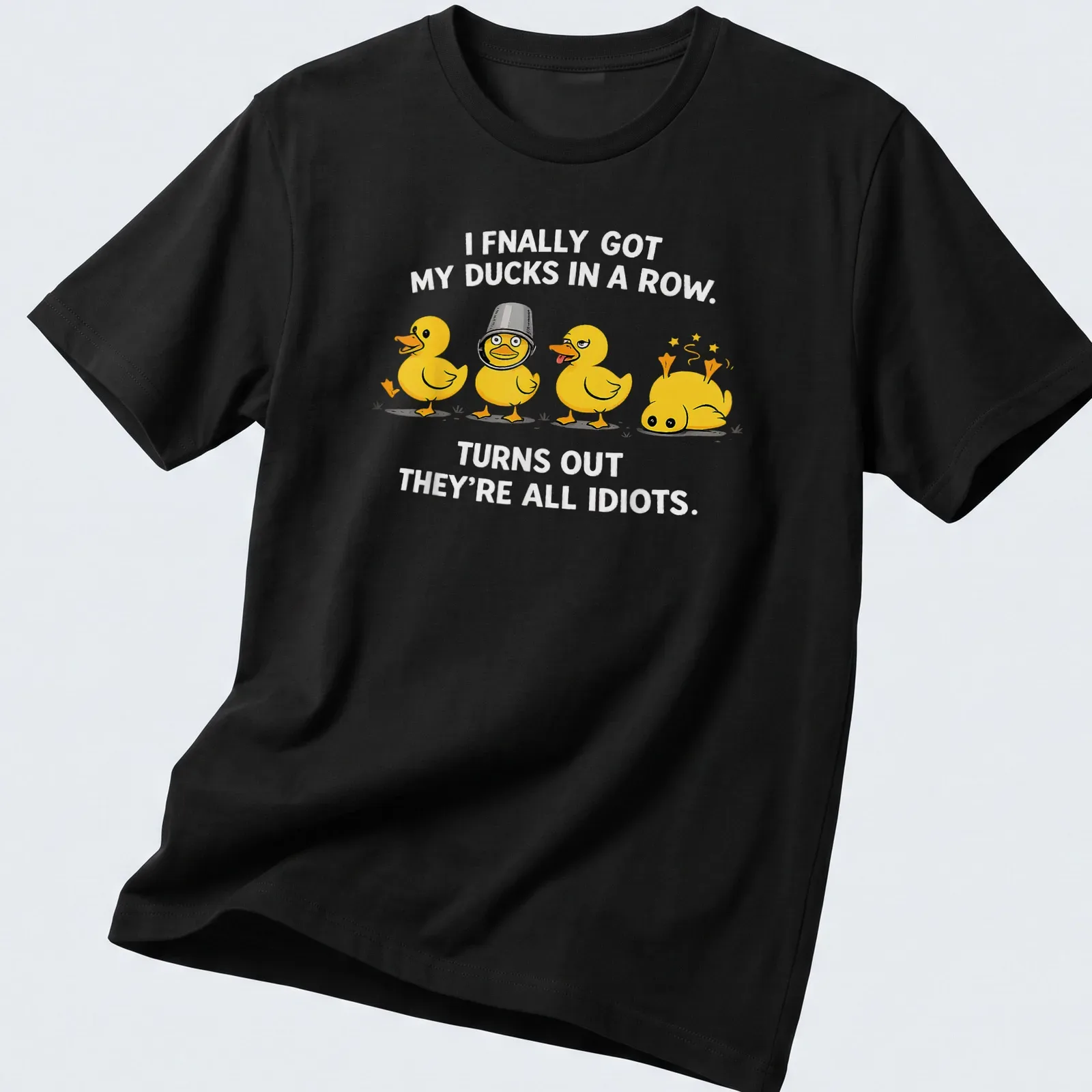 Cartoon ducks humorously illustrated, with text about getting ducks in a row. — printed on a unisex t-shirt